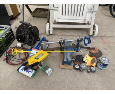 AN ASSORTMENT OF TOOLS TO INCLUDE A MITRE SAW, SANDING DISCS AND PADS AND A SET OF JUMP LEADS ETC 