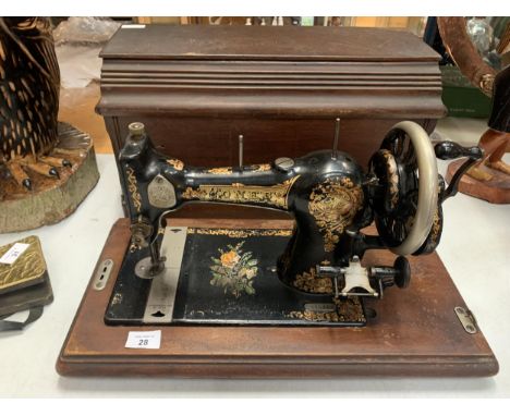 A CASED VINTAGE 'JONES' SEWING MACHINE NO. 37975 