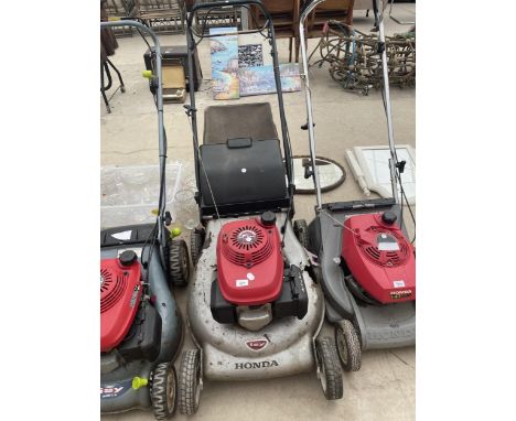 A HONDA PETROL LAWN MOWER, ENGINE BELIEVED IN WORKING ORDER BUT NO WARRANTY AND SLIGHT DAMAGE TO THE DECK 
