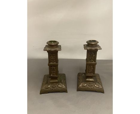 A PAIR OF ORNATE BRONZE CANDLESTICKS 