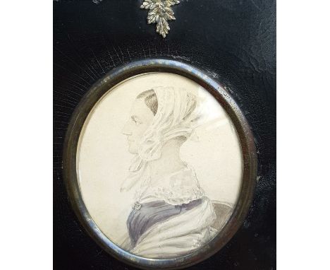 A portrait of "Miss. Betey Henec (?)", unsigned, watercolour on paper, within a black victorian frame, (8.5x7 cm).
