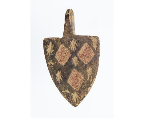 A complete cast copper-alloy and enamel heraldic harness pendant dating to the Medieval period, c. 1300-1400. The pendant is 