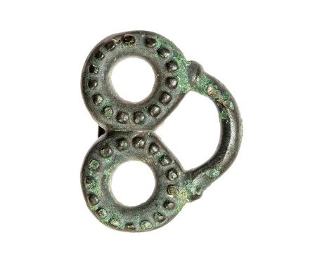 A complete cast copper-alloy probable strap fitting or toggle of Late Iron Age to early Roman date, c. 100 BC-AD 100. The fit