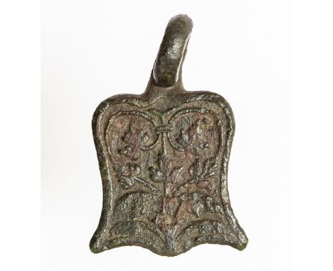 A complete cast copper-alloy sword belt fitting of probable 17th century date, c. 1600-1650. The object consists a broadly sh