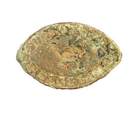 A cast copper-alloy 'vessica' type personal seal matrix dating to the Medieval period, c. 1200-1300. The matrix takes the for