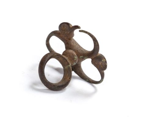 A complete cast copper-alloy triskele fob or mount dating to the later Iron Age or early Roman period, c. 200 BC-AD 100. The 