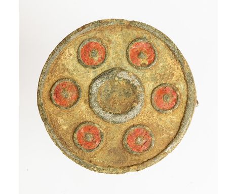 An incomplete cast copper-alloy plate brooch dating to the Roman period, c. AD 100-200. The brooch is circular in plan with a