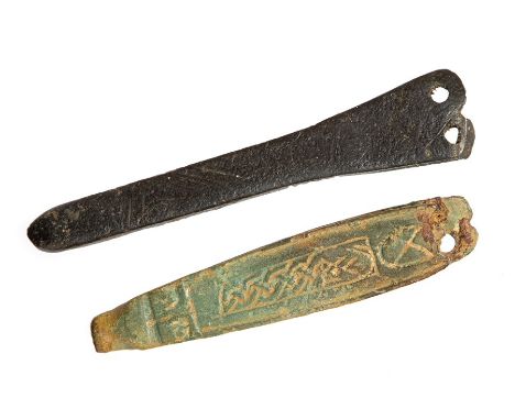 A lot of two Middle Saxon strap ends, dating c. 750-900. The first decorated in the Trewhiddle style and of Thomas' class A2,