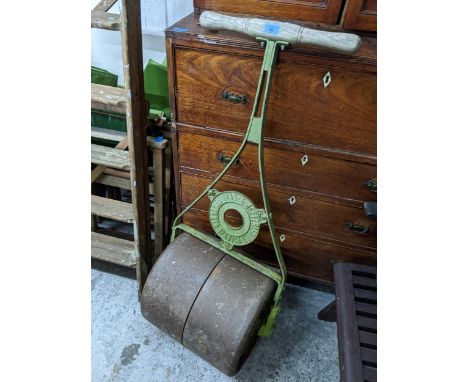 An early 20th century green painted cast iron Ransomes Sims and Jefferies garden roller with wooden handleLocation: 