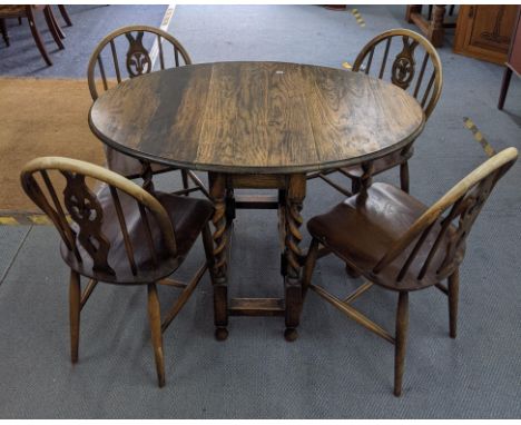 A set of four Ercol Windsor Chairs and a 1930s oak gale leg, barley twist table. 6 boxes of ceramicsLocation: 