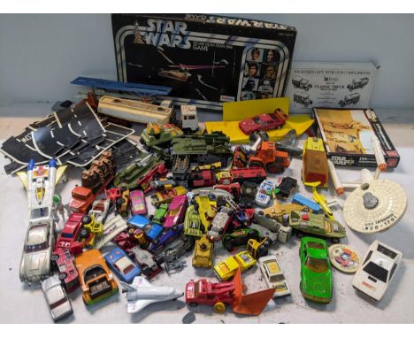 A selection of toys to include a Dinky U.S.S Enterprise, Corgi 007 Aston Martin DB5, 007 Lotus Esprit, Corgi Buck Rogers star