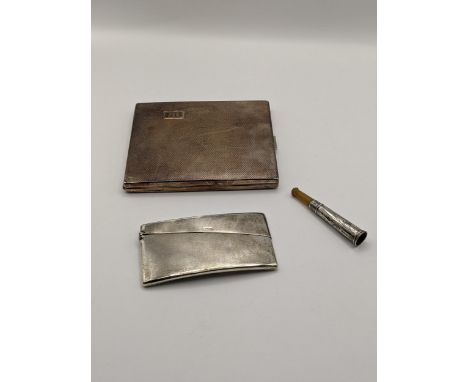 An early 20th century silver visiting card case with engine turned decoration, hallmarked Birmingham 1935, together with a si