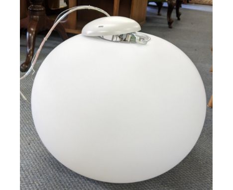 A modern ceiling hanging light with a milk glass shadeLocation: 