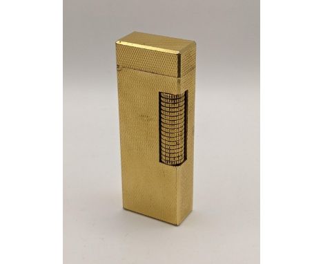 A Dunhill gold plated lighter having engine turned decorationLocation: 