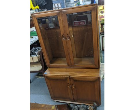 An Ercol Autumn Dawn Elan cabinet with two glazed doors over a pair of doorsLocation: 