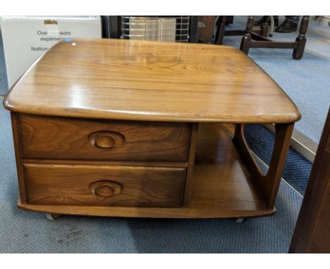 An Ercol Autumn Dawn coffee table bookcase with two drawersLocation: 