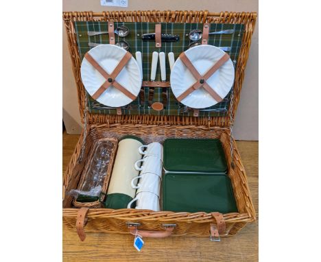 A W A Goold wicker picnic hamper, fitted interior with cutlery, Thermos flask and other accessories Location: 