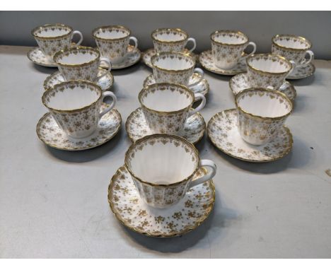 A set pf twelve Spode Fleur De Lys gold pattern tea cups and saucersLocation: 