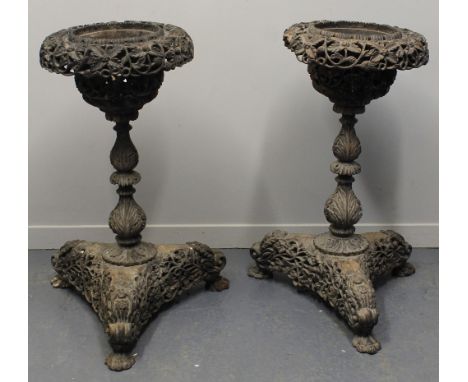 PAIR OF 19TH CENTURY INDO-BURMESE CARVED HARDWOOD, PEDESTAL PLANTERS, overall copiously carved and pierced with flower heads 