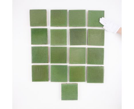 Grueby Faience Company, Boston, Massachusetts. Group of 17 American Arts and Crafts enameled green ceramic pottery tiles, lat