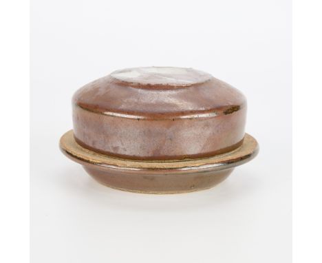 Warren MacKenzie (American, 1924-2018). Studio pottery ceramic covered dish. Stamped along the footrim.Warren MacKenzie was a