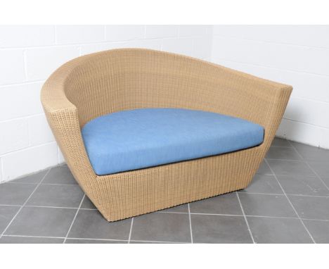 A Natural Rattan Veneman Collections Canoe sofa with blue half round cushions, width 166cm. Condition Report: 20% VAT will be