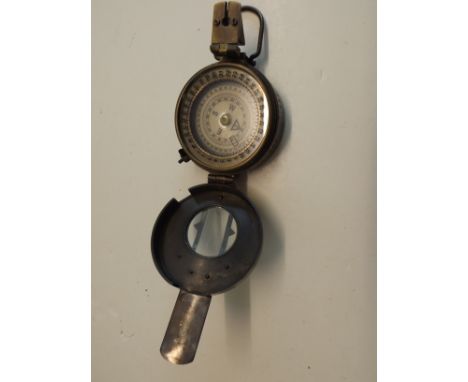 A Second World War sighting compass, impressed TG. Co. Ltd London MkIII 1941.