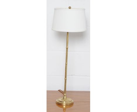 A brass faux bamboo table lamp and shade, height 73cm.
Note: This is a 110/120 volt appliance. Condition Report: 20% VAT will