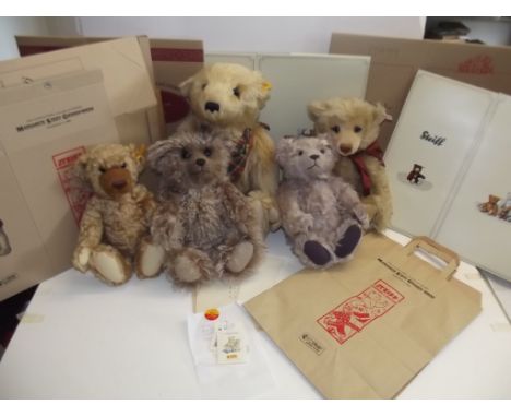 Five modern Steiff teddy bears together with packaging.