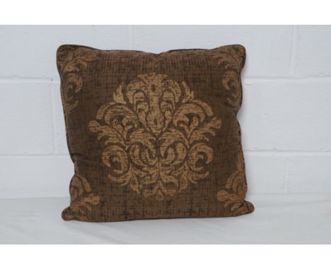 Four baroque style brown print cushions. Condition Report: 20% VAT will be charged on the hammer price in addition to our nor