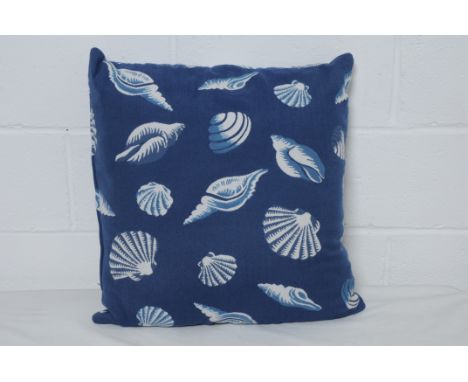 Three dark blue ground shell print cushions. Condition Report: 20% VAT will be charged on the hammer price in addition to our