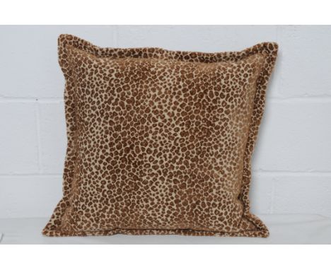Four brown leopard print cushions. Condition Report: 20% VAT will be charged on the hammer price in addition to our normal co