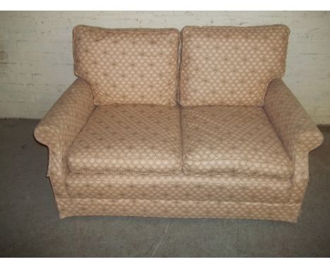 A FABRIC SPRUNG EDGE TWO SEATER SOFA