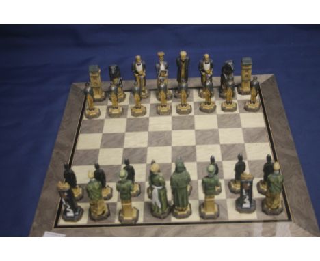 AN UNBOXED PAINTED STUDIO ANNE CARLTON SHERLOCK HOLMES CHESS SET