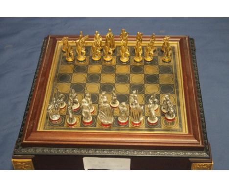 A METAL CHESS SET IN FITTED CASE