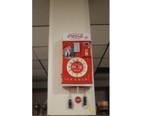 A RETRO STYLE COCACOLA WALL CLOCK