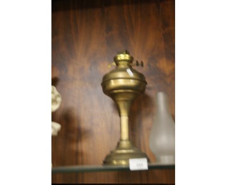 A BRASS OIL LAMP WITH CHIMNEY