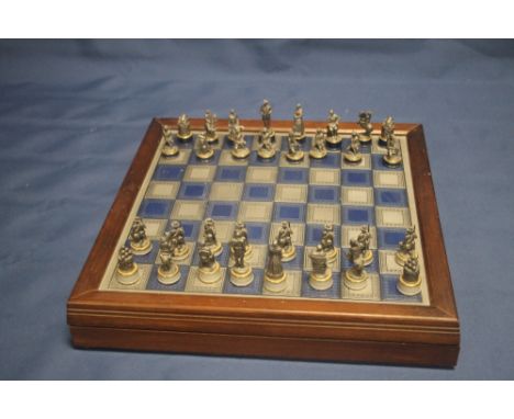 A WHITE METAL CHESS SET