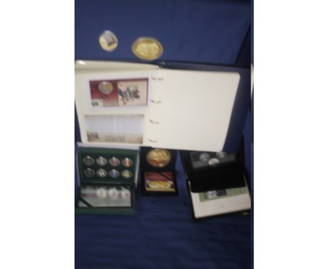 A COLLECTION OF BOXED COMMEMORATIVE AND OTHER COINS TOGETHER WITH AN ALBUM OF FIRST DAY COVERS