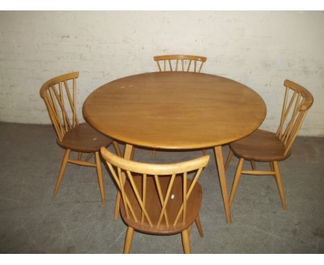 A LIGHT ERCOL STICK BACK DROPLEAF DINING SET