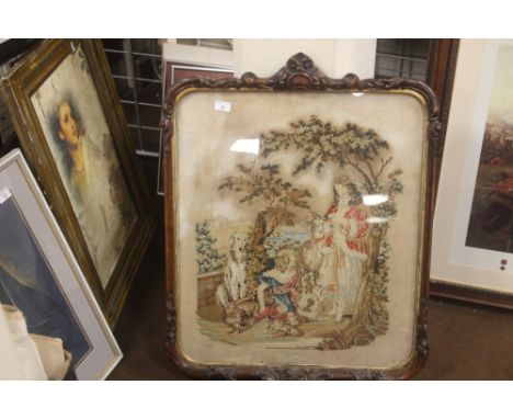 A FRAMED TAPESTRY WITH CARVED FRAME