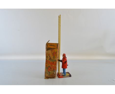 A Marx Toys Climbing Fireman, tinplate clockwork toy, with box