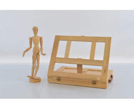An artists lay figure, on stand, 33cm high together with travelling easel and box