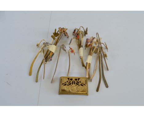 A collection of brass book marks, having coloured enamel mounts to include butterflies, birds, flowers, cross etc (26) togeth