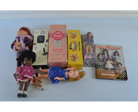 A mixed collection of dolls, including a Pelham Puppet Poodle, Barbie Fashion Model Collection doll, Little Beauty Dressed Do