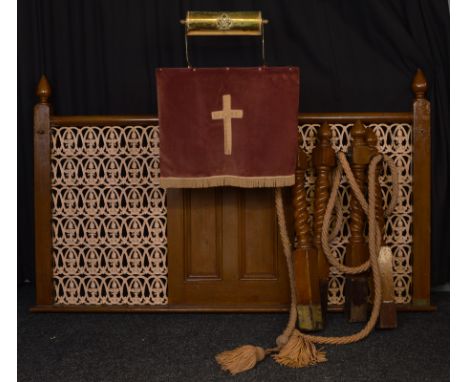 A cast iron and painted oak Preacher's lectern and screen, with repeating floral and scroll grill panels either side of a pro