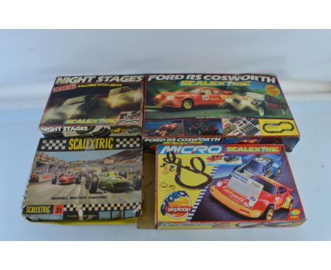 Three Scalextric sets, Ford Cosworth, Set 31, Night Stages, together with a Micro G-Force Skyloop set (4), 