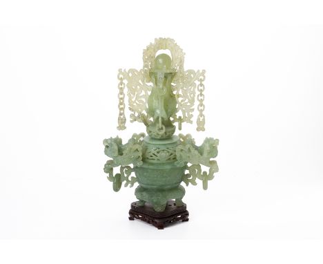 A CARVED SERPENTINE / JADE CENSER AND COVER
In three sections, with elaborate decoration, dragon drop ring handles, chains, a