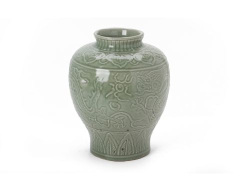 A MOUDLED CELADON BALUSTER VASE
Decorated with dragons chasing a pearl between continuous ruyi and stiff leaf borders
25cm hi