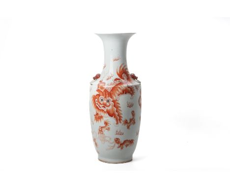 A LARGE IRON RED DECORATED PORCELAIN VASE
Decorated with foo dogs, with twin mask ring handles and calligraphy to reverse
60c